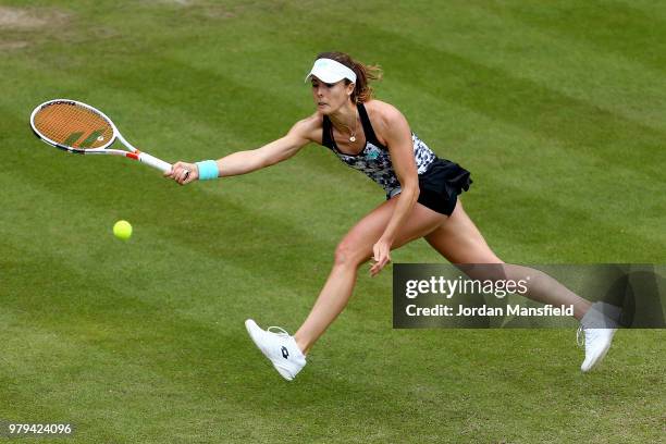 Alize Cornet of France reaches for a forehand during her Round of 16 match against Elina Svitolina of the Ukraine during Day Five of the Nature...