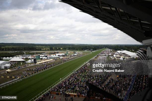 Crowds gather to watch the race on day 1 of Royal Ascot at Ascot Racecourse on June 19, 2018 in Ascot, England.