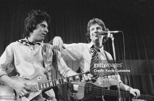 Guitarist Danny Kustow and singer and bassist Tom Robinson of the Tom Robinson Band perform on stage at the Middleton Civic Hall in Manchester,...