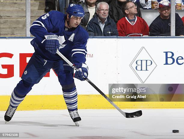 Tomas Kaberle of the Toronto Maple Leafs looks to pass the puck during the game against the Montreal Canadiens on March 20, 2010 at the Air Canada...