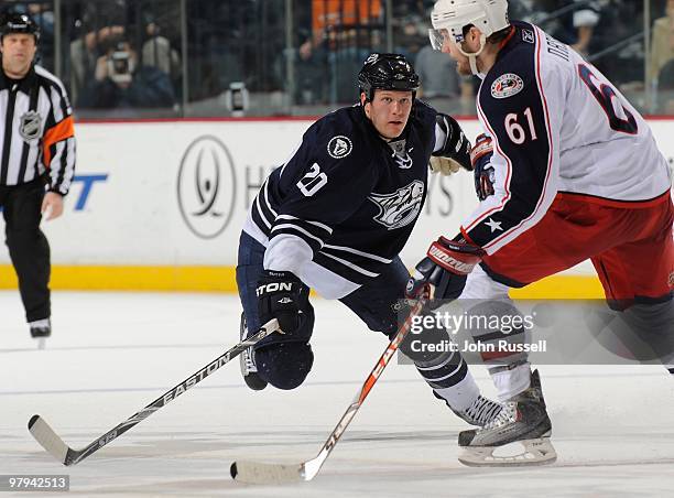 Ryan Suter of the Nashville Predators skates against Rick Nash of the Columbus Blue Jackets on March 20, 2010 at the Bridgestone Arena in Nashville,...