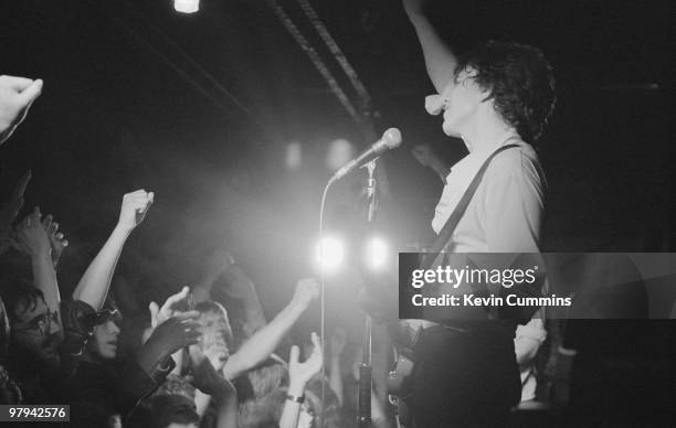 Singer and bassist Tom Robinson of the Tom Robinson Band performs on stage at Rafters in Manchester, England circa 1978.