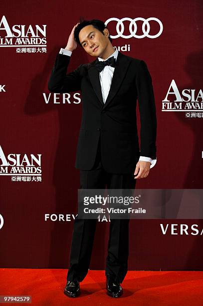 Hong Kong singer and actor Julian Cheung Chi Lam poses on the red carpet for the 4th Asian Film Awards ceremony at the Convention and Exhibition...