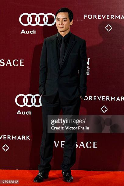 Hong Kong actor Daniel Wu poses on the red carpet for the 4th Asian Film Awards ceremony at the Convention and Exhibition Centre on March 22, 2010 in...