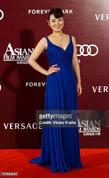 Chinese actress Yan Ni poses on the red carpet for the 4th Asian Film Awards ceremony at the Convention and Exhibition Centre on March 22, 2010 in...
