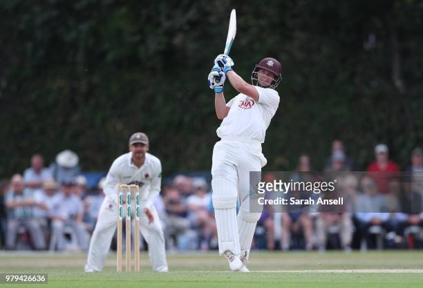Scott Borthwick of Surrey hits a boundary during day 1 of the Specsavers County Championship Division One match between Surrey and Somerset on June...