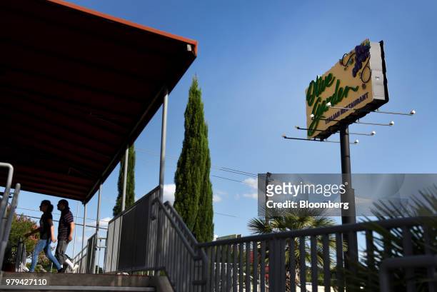 Customers arrive at a Darden Restaurants Inc. Olive Garden location in San Antonio, Texas, U.S., on Tuesday, June 12, 2018. Darden Restaurants Inc....