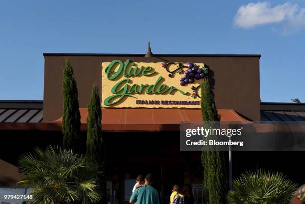 Customers arrive at a Darden Restaurants Inc. Olive Garden location in San Antonio, Texas, U.S., on Tuesday, June 12, 2018. Darden Restaurants Inc....