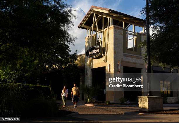 Customers exit after dining at a Darden Restaurants Inc. Yard House location in San Antonio, Texas, U.S., on Wednesday, June 13, 2018. Darden...