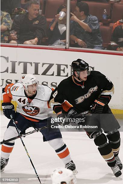 Bobby Ryan of the Anaheim Ducks defends against Freddy Meyer of the New York Islanders during the game on March 19, 2010 at Honda Center in Anaheim,...