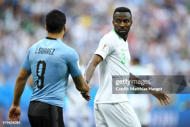 Luis Suarez of Uruguay shakes hands with Osama Hawsawi of Saudi Arabia during the 2018 FIFA World Cup Russia group A match between Uruguay and Saudi...
