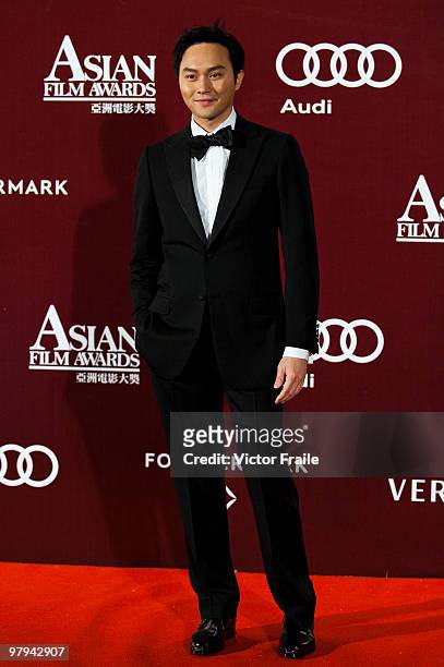 Hong Kong singer and actor Julian Cheung Chi Lam poses on the red carpet for the 4th Asian Film Awards ceremony at the Convention and Exhibition...
