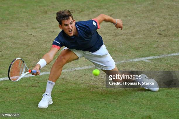 Dominic Thiem of Austria plays a forehand in his match against Yuichi Sugita of Japan during day three of the Gerry Weber Open at Gerry Weber Stadium...