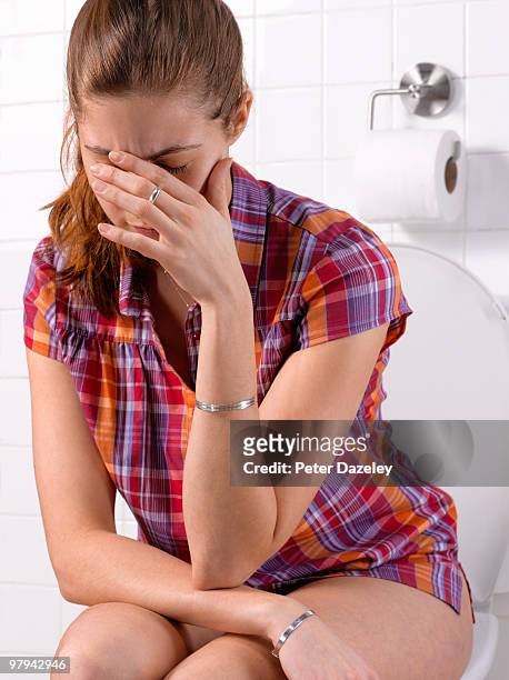 girl with constipation ibs in bathroom - woman hemorrhoids stock pictures, royalty-free photos & images