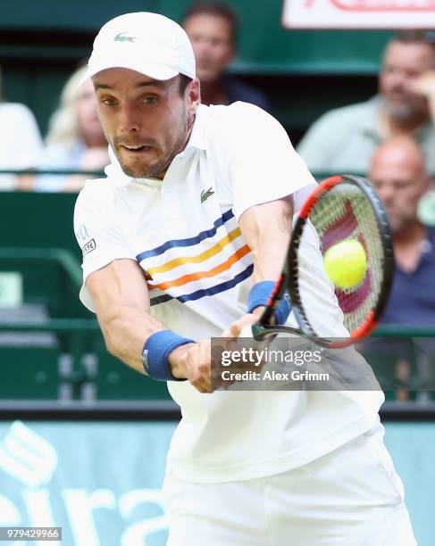 Roberto Bautista Agut of Spain plays a backhand to Robin Hase of Netherlands during their round of 16 match on day 3 of the Gerry Weber Open at Gerry...