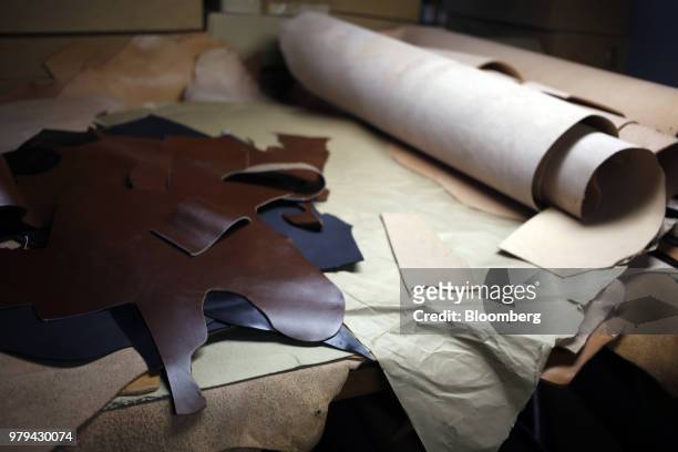 Pieces of leather sit on a table at the Dehner Co. Boot factory in Omaha, Nebraska, U.S., on Tuesday, June 5, 2018. Markit is scheduled to release...