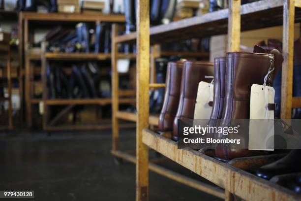 Tags hang from leather boots at the Dehner Co. Factory in Omaha, Nebraska, U.S., on Tuesday, June 5, 2018. Markit is scheduled to release...