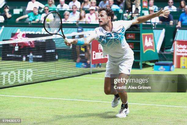 Robin Haase of Netherlands plays a backhand to Roberto Bautista Agut of Spain during their round of 16 match on day 3 of the Gerry Weber Open at...