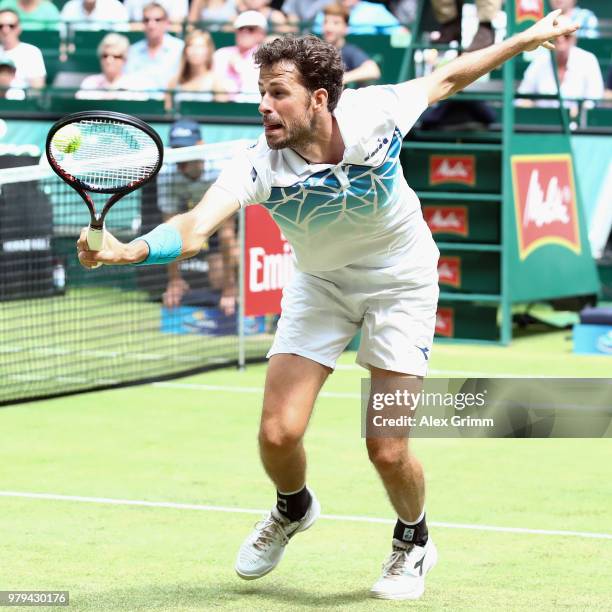 Robin Haase of Netherlands plays a backhand to Roberto Bautista Agut of Spain during their round of 16 match on day 3 of the Gerry Weber Open at...