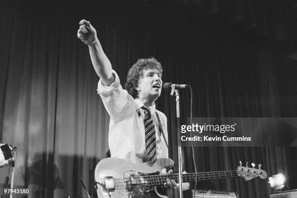 Singer and bassist Tom Robinson of the Tom Robinson Band performs on stage at the Middleton Civic Hall in Manchester, England on October 05, 1977.
