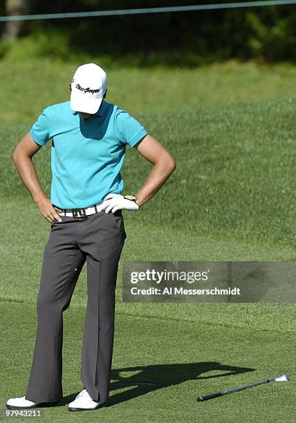 Aaron Baddeley tosses his club after hitting an approach shot into the water on the eighth hole during the second round of the Bay Hill Invitational,...