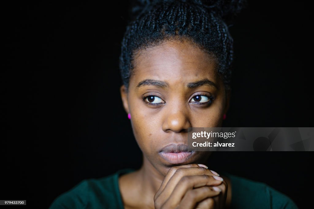 Close-Up Of Worried Woman Looking Away