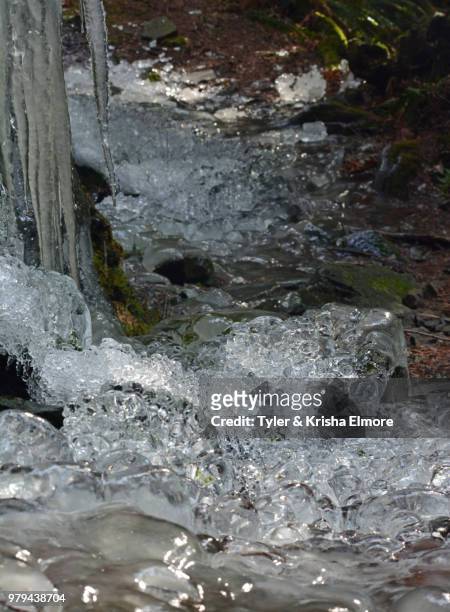 rushing water or ice? - elmore stock pictures, royalty-free photos & images