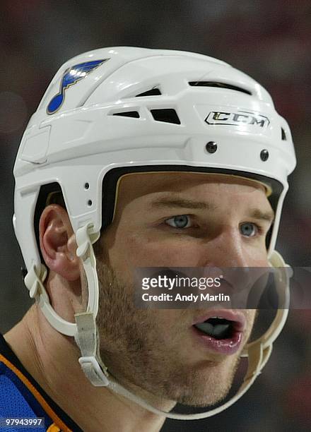 Cam Janssen of the St. Louis Blues looks on against the New Jersey Devils during the game at the Prudential Center on March 20, 2010 in Newark, New...
