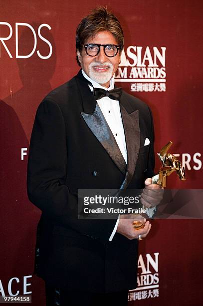 Indian actor Amitabh Bachchan poses backstage after winning the after winning the Lifetime Achievement Award during the 4th Asian Film Awards...