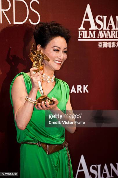 Hong Kong actress Wai Ying-hung poses backstage after winning the Best Supporting Actress Award during the 4th Asian Film Awards ceremony at the...