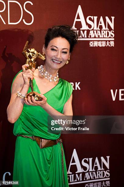 Hong Kong actress Wai Ying-hung poses backstage after winning the Best Supporting Actress Award during the 4th Asian Film Awards ceremony at the...