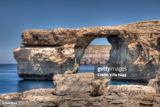 natural arch rock formation of azure window on seashore under clear sky, san lawrenz, gozo, malta - dwejra imagens e fotografias de stock