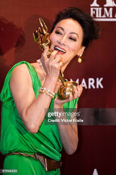 Hong Kong actress Wai Ying-hung poses backstage after winning the Best Supporting Actress Award during the 4th Asian Film Awards ceremony at the...