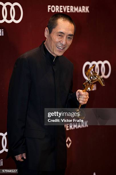 Chinese director Zhang Yimou poses backstage after after receiving the Outstanding Contribution to Asian Cinema Award during the 4th Asian Film...