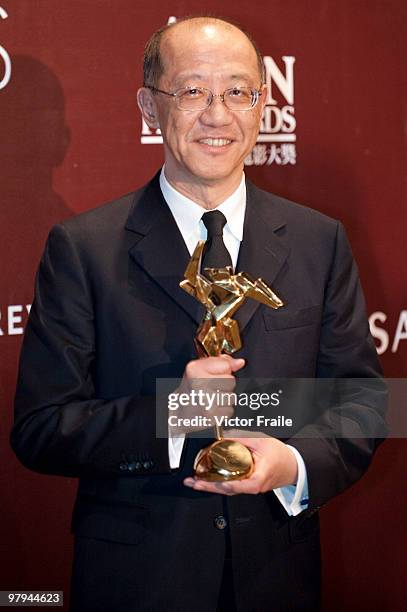 Film producer Terence Chang poses backstage with 2009's Top-Grossing Film Director Award representing Chinese director John Woo during the 4th Asian...