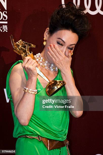 Hong Kong actress Wai Ying-hung poses backstage after winning the Best Supporting Actress Award during the 4th Asian Film Awards ceremony at the...