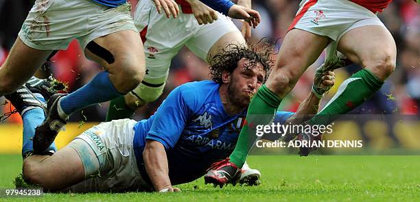 Italy's Flanker Mauro Bergamasco grabs the shorts of Wales' Wing Shane Williams during the RBS Six Nations International rugby union match at The...