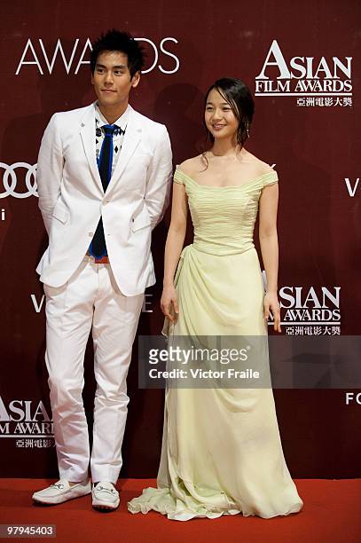 Taiwanese actor Eddie Peng and South Korean actress Kim Kkobbi pose backstage during the 4th Asian Film Awards ceremony at the Convention and...