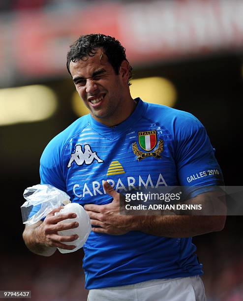 Italy's Centre Gonzalo Canale leaves the field injured early in the game against Wales during the RBS Six Nations International rugby union match at...