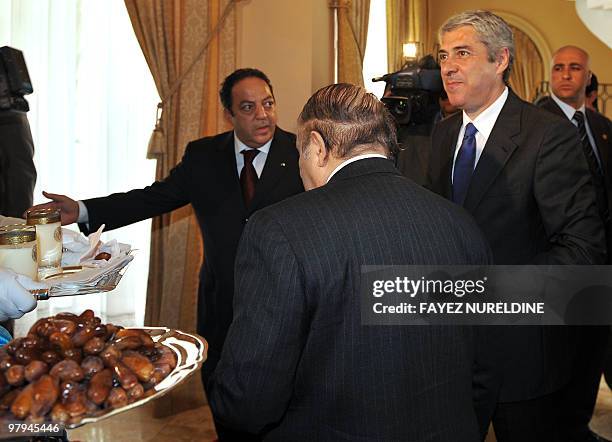 Algerian President Abdelaziz Bouteflika escorts Portugal's Prime Minister Jose Socrates during their meeting, on March 22, 2010. Socrates arrived in...