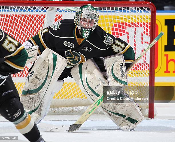 Michael Hutchinson of the London Knights keeps an eye for a shot in the first game of the opening round of the 2010 playoffs against the Guelph Storm...