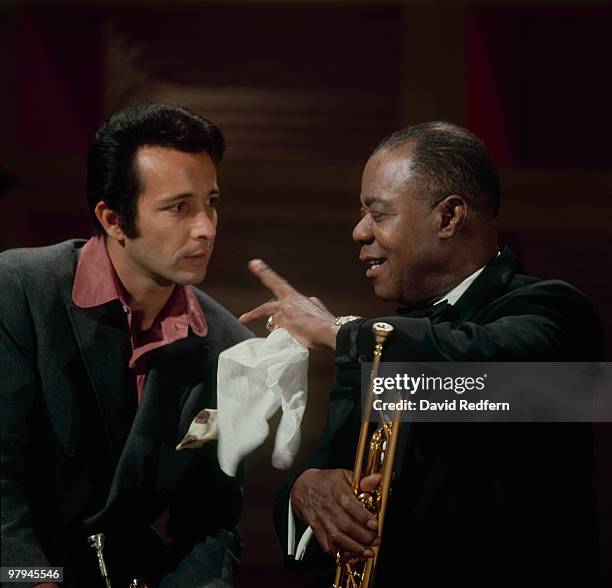 American trumpet players Herb Alpert and Louis Armstrong perform together on the Kraft Music Hall television show at NBC Television Studios in New...