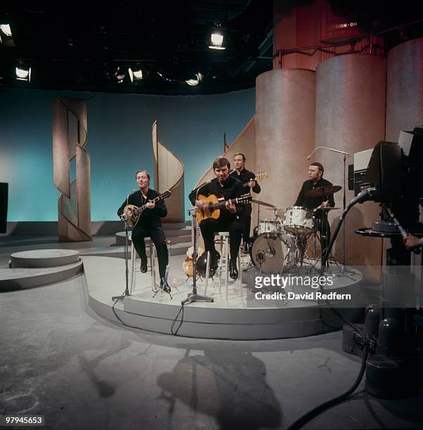Nana Mouskouri's backing group The Athenians, with her husband George Petsilas on guitar, perform on a television show in the 1970's.
