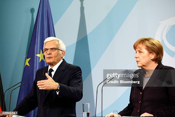 Jerzy Buzek, president of the European Parliament, left and Angela Merkel, Germany's chancellor, hold a news conference in Berlin, Germany, on...