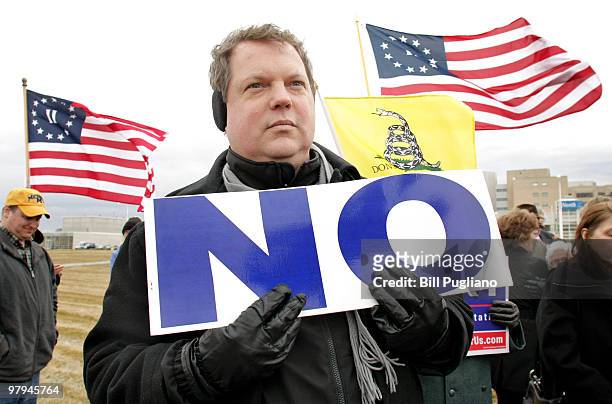 Glenn Clark of Troy, Michigan attends a rally for a ballot initiative opposing the new federal health care bill March 22, 2010 in Royal Oak,...