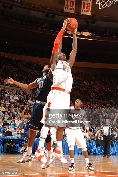 Rick Jackson of the Syracuse Orange pulls down a rebound during the Big East Quarterfinal College Basketball Championship game against the Georgetown...