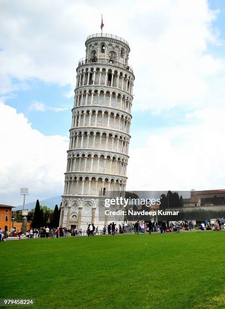 tourists by leaning tower of pisa, pisa, italy - pisa tower stock pictures, royalty-free photos & images