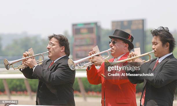 Three horns call the riders to the track at Belmont Park in Elmont, New York, site of the 2005 Belmont Stakes, on June 11, 2005.