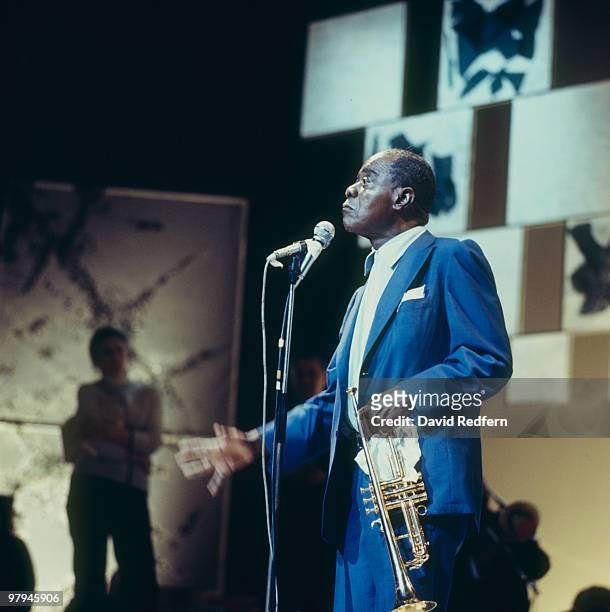 American jazz trumpeter and singer Louis Armstrong performs on stage in November 1970.