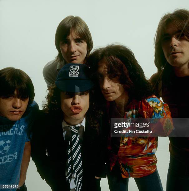 Malcolm Young, Phil Rudd, Angus Young, Bon Scott and Cliff Williams of Australian rock band AC/DC pose in Camden, London in August 1979 .